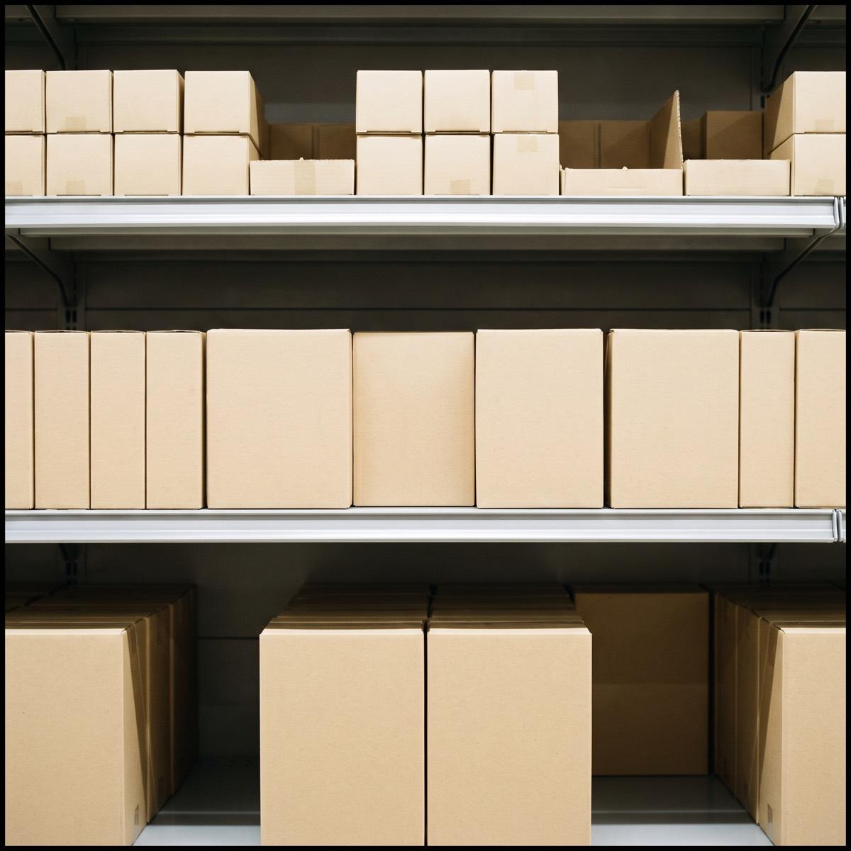 Three shelves of the same product in three sizes, the middle row untouched while the others are picked over